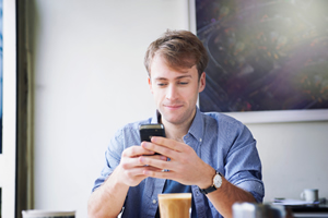 Man Texting In His Office